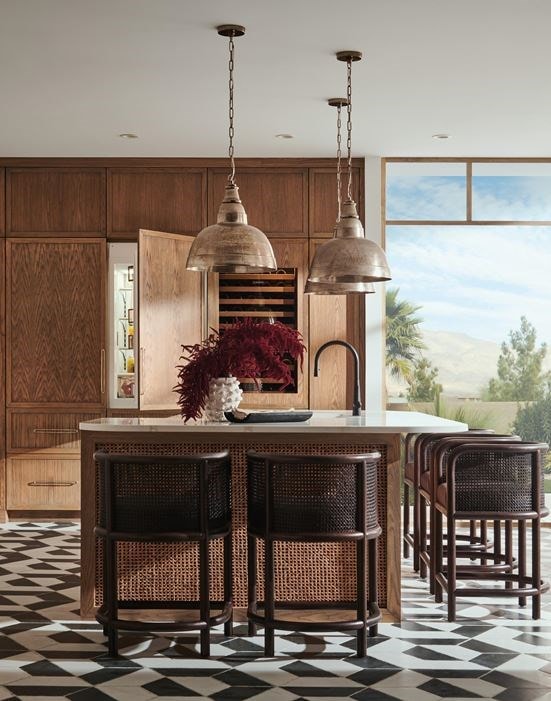 Panel Ready Sub-Zero 30 Inch Freezer Column with Ice Maker paired with Sub-Zero 30 Inch Tall Refrigerator with Internal Dispenser shown in a modern bright and open custom kitchen design